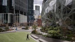The Amazon headquarters sits virtually empty on March 10, 2020 in downtown Seattle, Washington. In response to the coronavirus outbreak, Amazon recommended all employees in its Seattle headquarters to work from home, leaving much of downtown nearly void of people. The Amazon Spheres conservatory, (R) serves as an employee lounge and workspace. (Photo by John Moore/Getty Images)