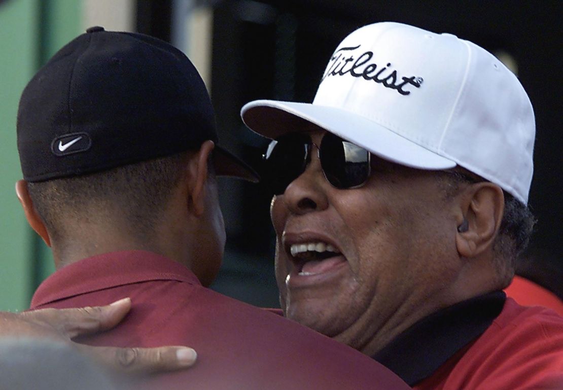 Woods is hugged by his father Earl  after winning the 2001 Masters.