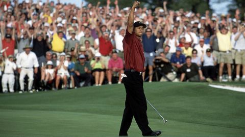 Woods celebrates after winning the 2001 Masters.