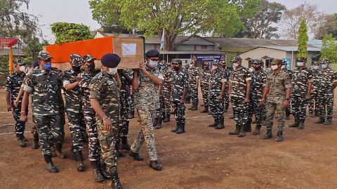 Members of Indian security forces carry the coffin of one of their colleagues, who died following a battle with Maoist rebels in India's Chhattisgarh state, on April 4.