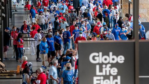 Fans walk through the main concourse of Globe Life Field before the Texas Rangers home opener baseball game against the Toronto Blue Jays on April 5, 2021.
