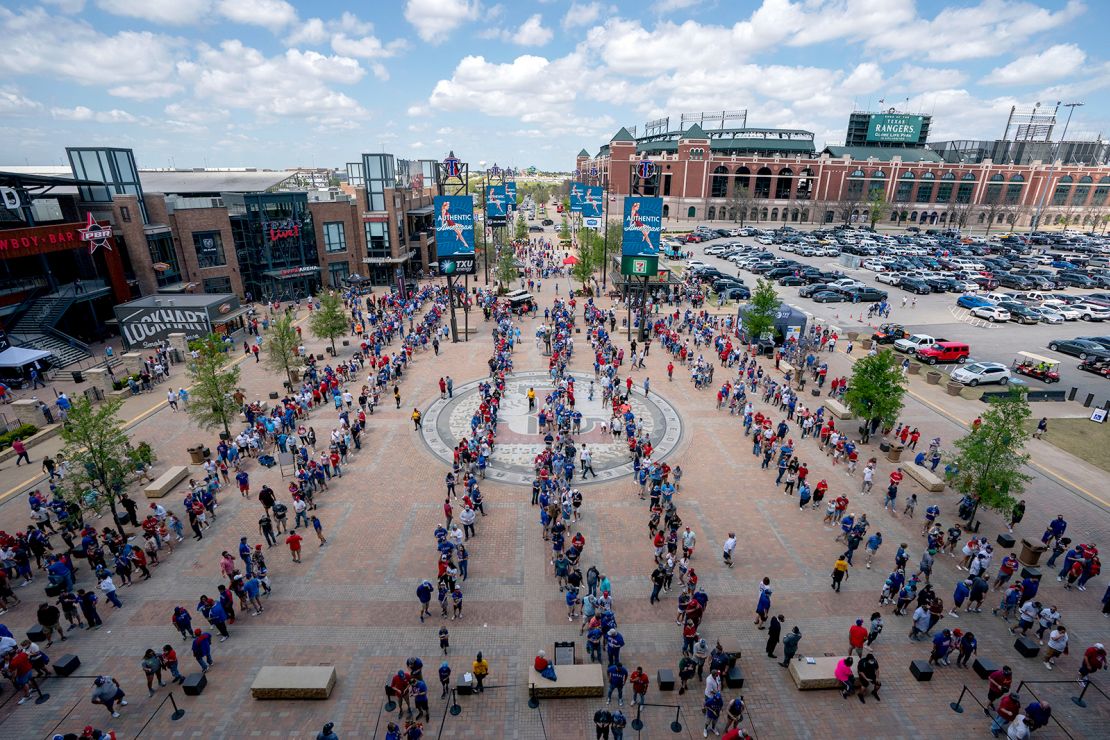 Fans line up to enter Globe Life Field before the Texas Rangers home opener baseball game against the Toronto Blue Jays on April 5, 2021, in Arlington, Texas. 