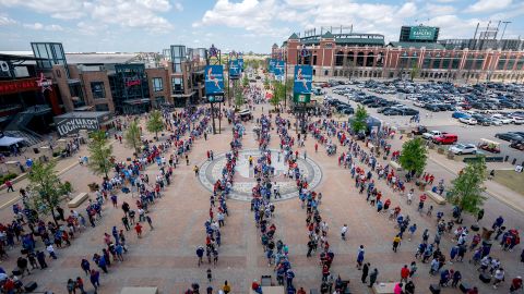 Fans line up to enter Globe Life Field before the Texas Rangers home opener baseball game against the Toronto Blue Jays on April 5, 2021, in Arlington, Texas.