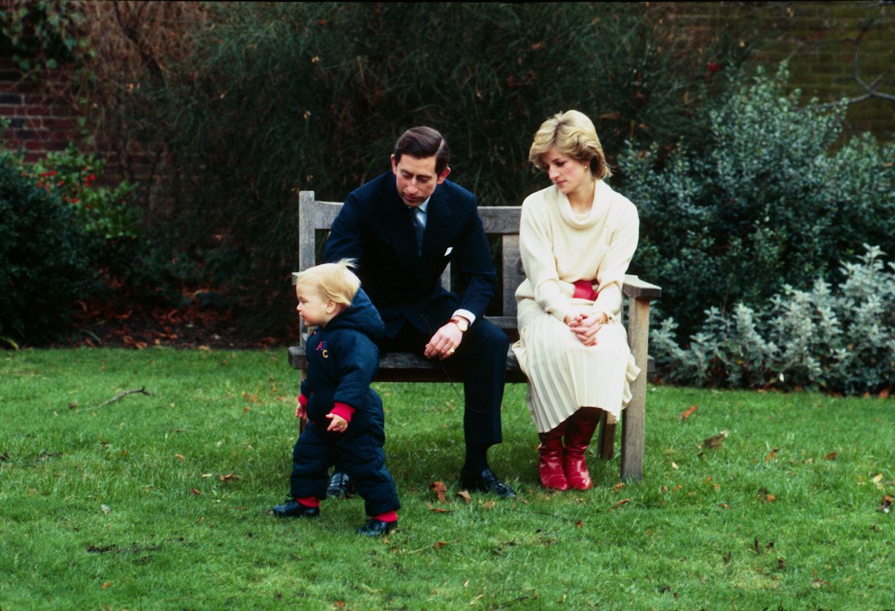 Prince William is watched by his parents as he takes his first steps in public at Kensington Palace in 1983.