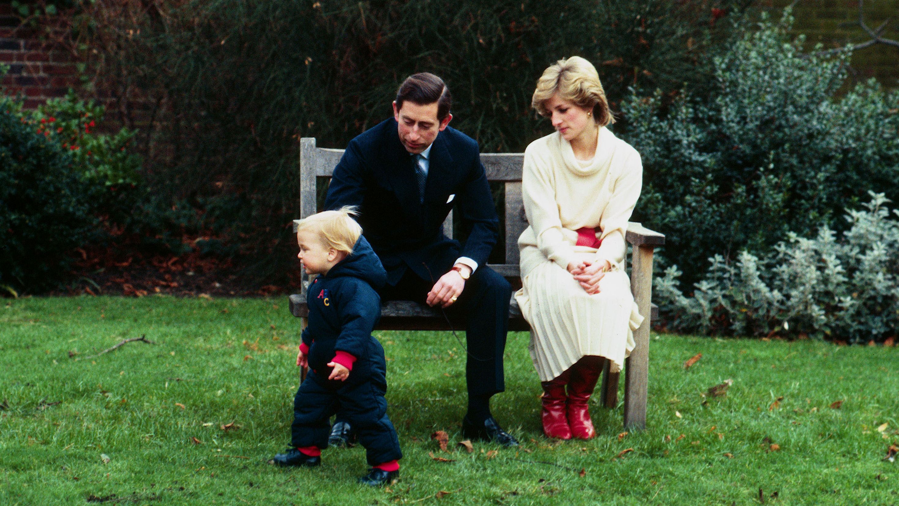 Prince William is watched by his parents as he takes his first steps in public at Kensington Palace in 1983.