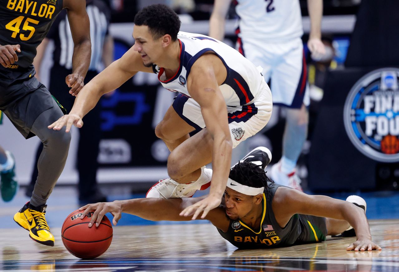 Flo Thamba dives for a loose ball in the first half.