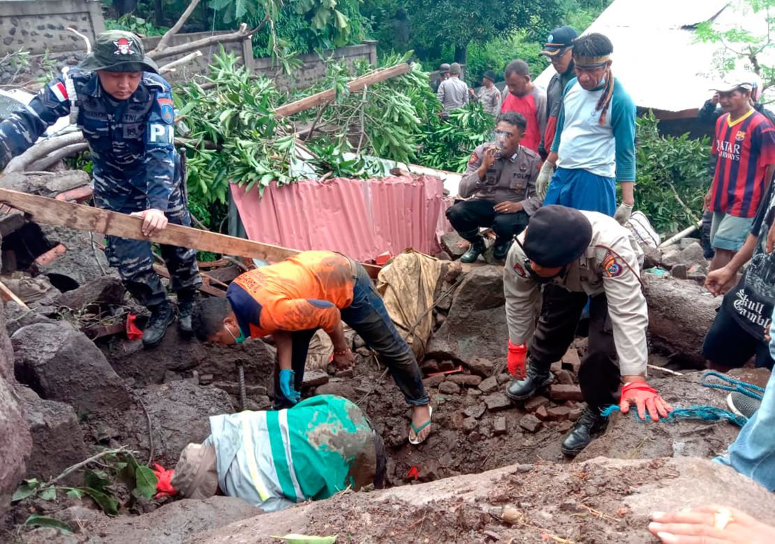 Rescuers search for victims at a village in Ile Ape Timur on Lembata Island, Indonesia, on April 5.