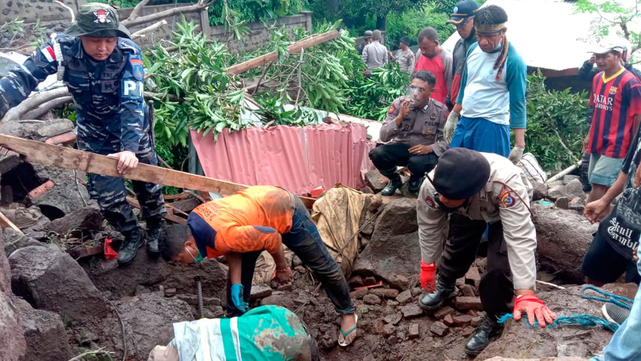 Rescuers search for victims at a village in Ile Ape Timur on Lembata Island, Indonesia, on April 5.