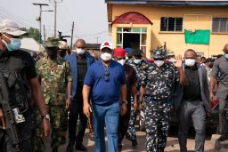 Imo state Gov. Hope Uzodinma, center, inspects the scene of an attack at the police command headquarters in Owerri, Nigeria, on Monday, April 5, 2021. 