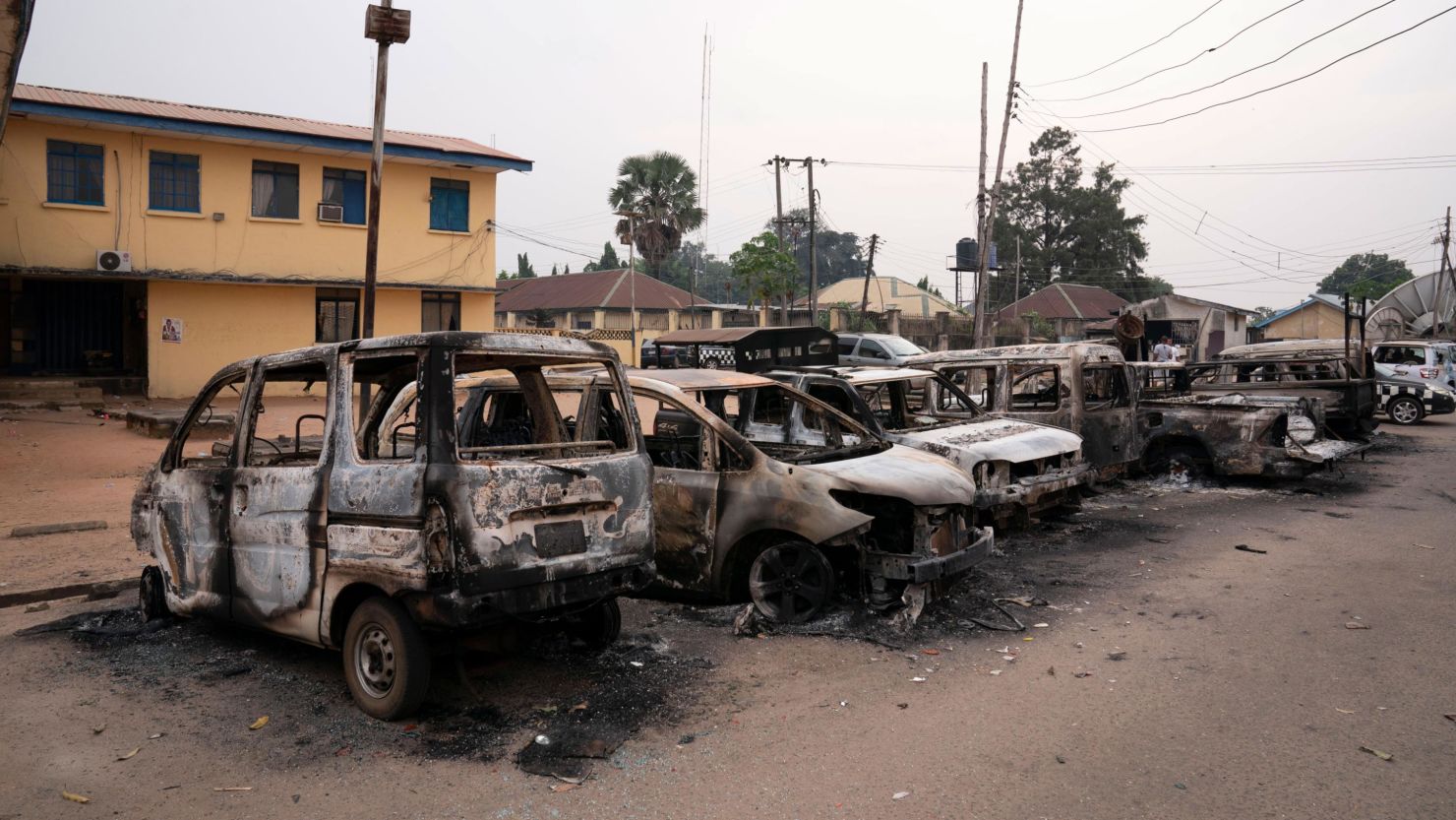 Burned vehicles are parked outside the police command headquarters in Owerri, Nigeria, on Monday, April 5, 2021. 