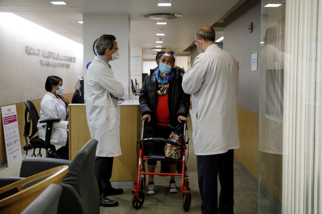 Trachea transplant recipient Sonia Sein talks with the lead surgeon of her procedure, Dr. Eric Genden, left, and Dr. Sandy Florman during a March checkup visit at Mt. Sinai hospital.