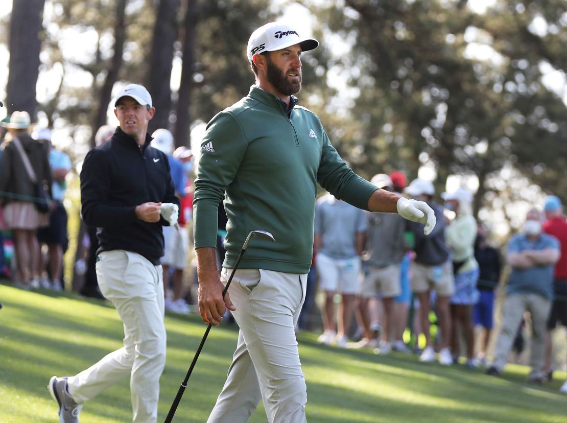Defending champion Dustin Johnson (right) and Rory McIlroy walk the fourth fairway after teeing off during their practice round for the Masters.