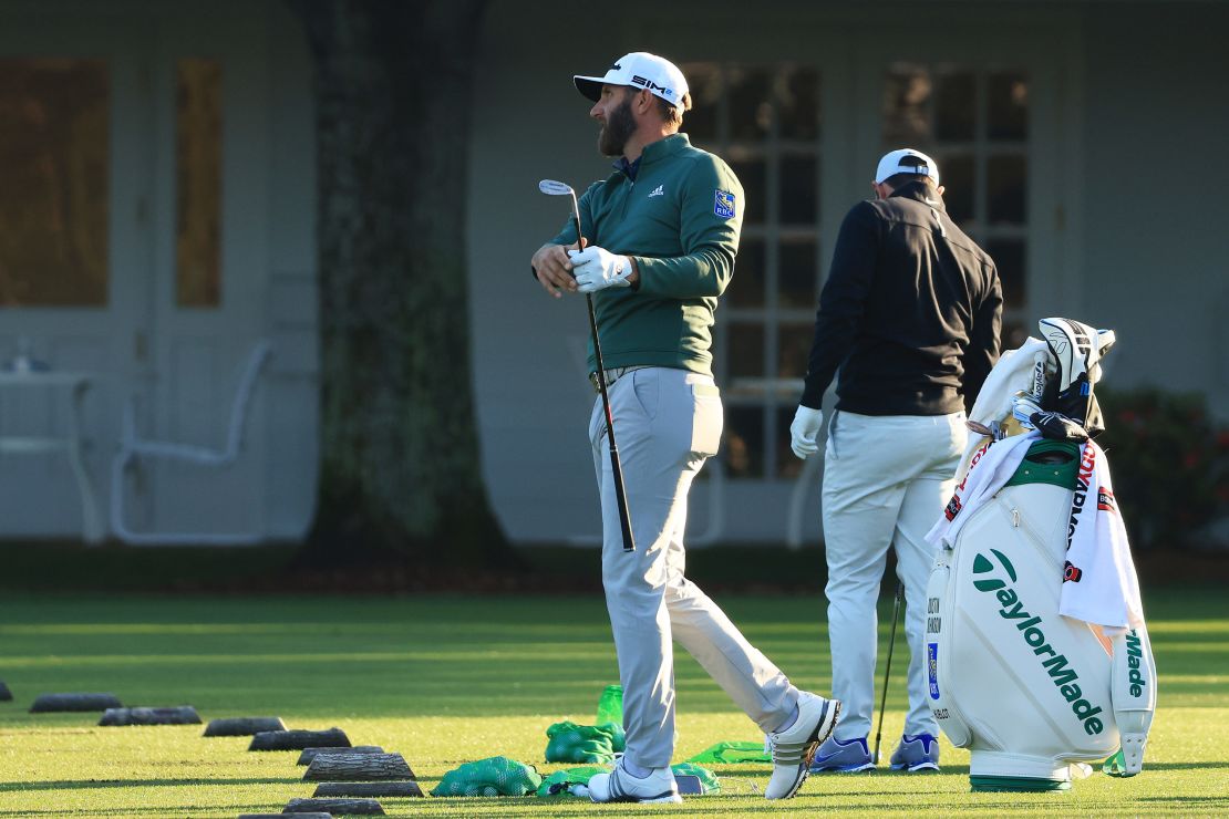 Johnson warms up on the range during a practice round prior to the Masters.