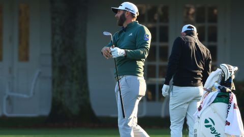 Johnson warms up on the range during a practice round prior to the Masters.