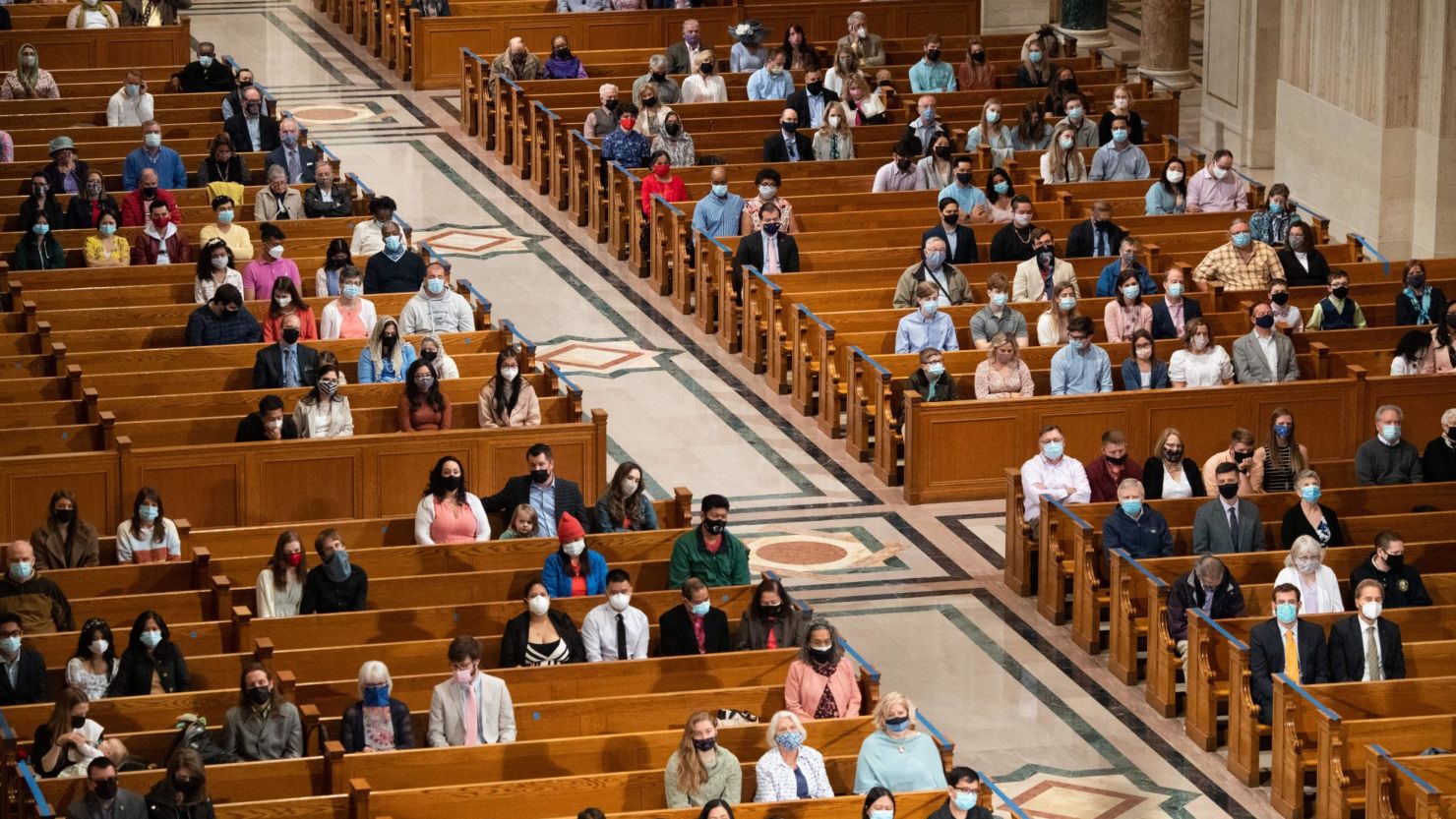 People attend Easter Sunday Mass while adhering to social distancing guidelines at the Basilica of the National Shrine of the Immaculate Conception in Washington, DC, on April 4.