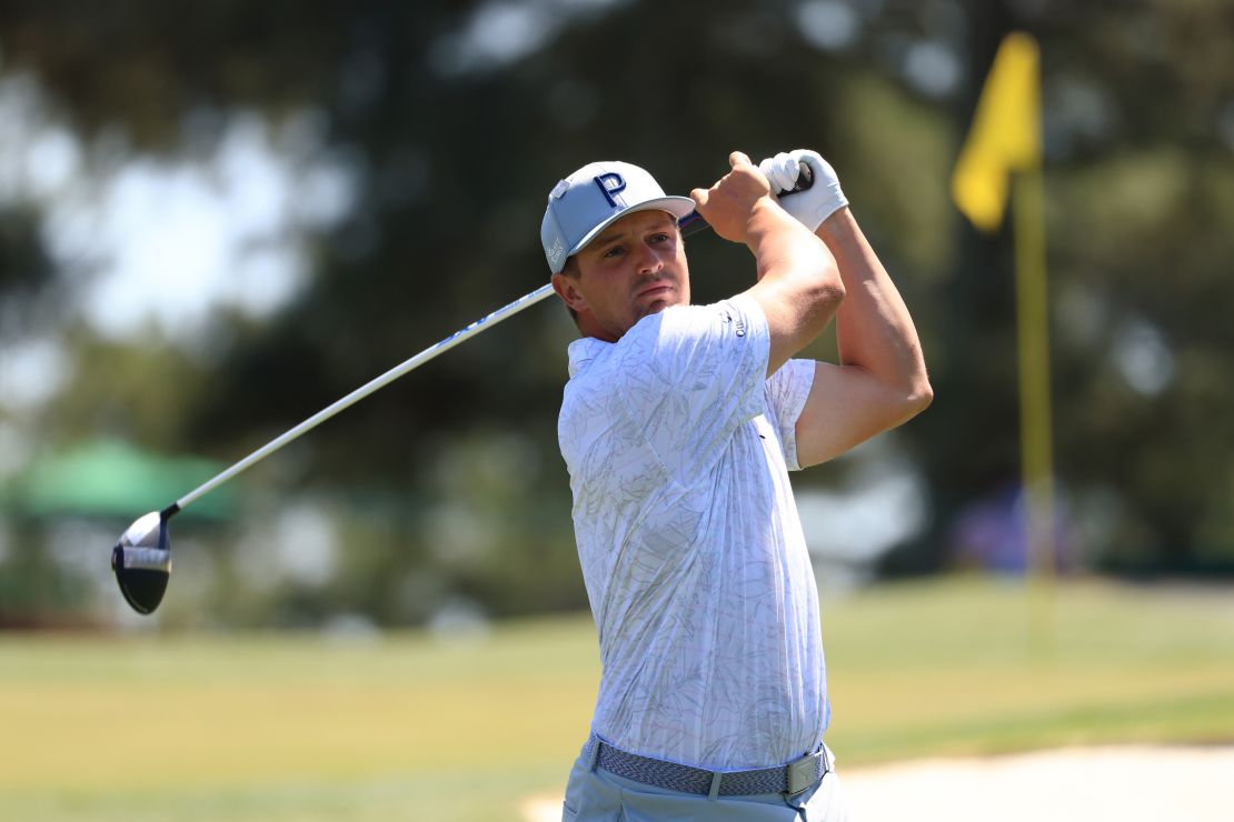 DeChambeau plays his shot from the third tee during a practice round prior to the Masters.