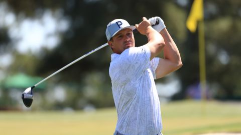 DeChambeau plays his shot from the third tee during a practice round prior to the Masters.