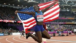 LONDON, ENGLAND - AUGUST 12:  Dawn Harper Nelson of the United States, silver, celebrates with an American flag after the Women's 100 metres hurdles final during day nine of the 16th IAAF World Athletics Championships London 2017 at The London Stadium on August 12, 2017 in London, United Kingdom.  (Photo by Patrick Smith/Getty Images)