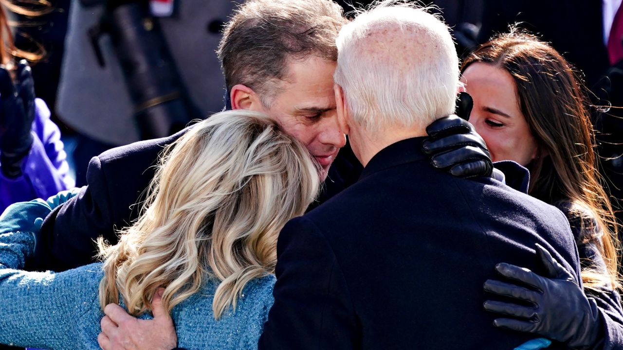 US President Joe Biden is embraced by his son Hunter Biden and First Lady Jill Biden after being sworn into office on January 20, 2021 in Washington, DC.