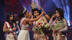 In this photograph taken on April 4, 2021, winner of Mrs. Sri Lanka 2020 Caroline Jurie (2-L) removes the crown of 2021 winner Pushpika de Silva (C) as she is disqualified by the jurie over the accusation of being divorced, at a beauty pageant for married women in Colombo. (Photo by - / AFP) (Photo by -/AFP via Getty Images)