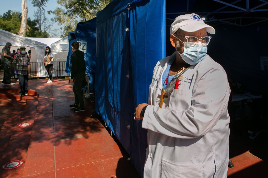 Dr. Jerry P. Abraham, director of vaccine programs at Kedren Health, oversees another day were hundreds of people line up for their turn at receiving the Covid-19 vaccine at Kedren Health.