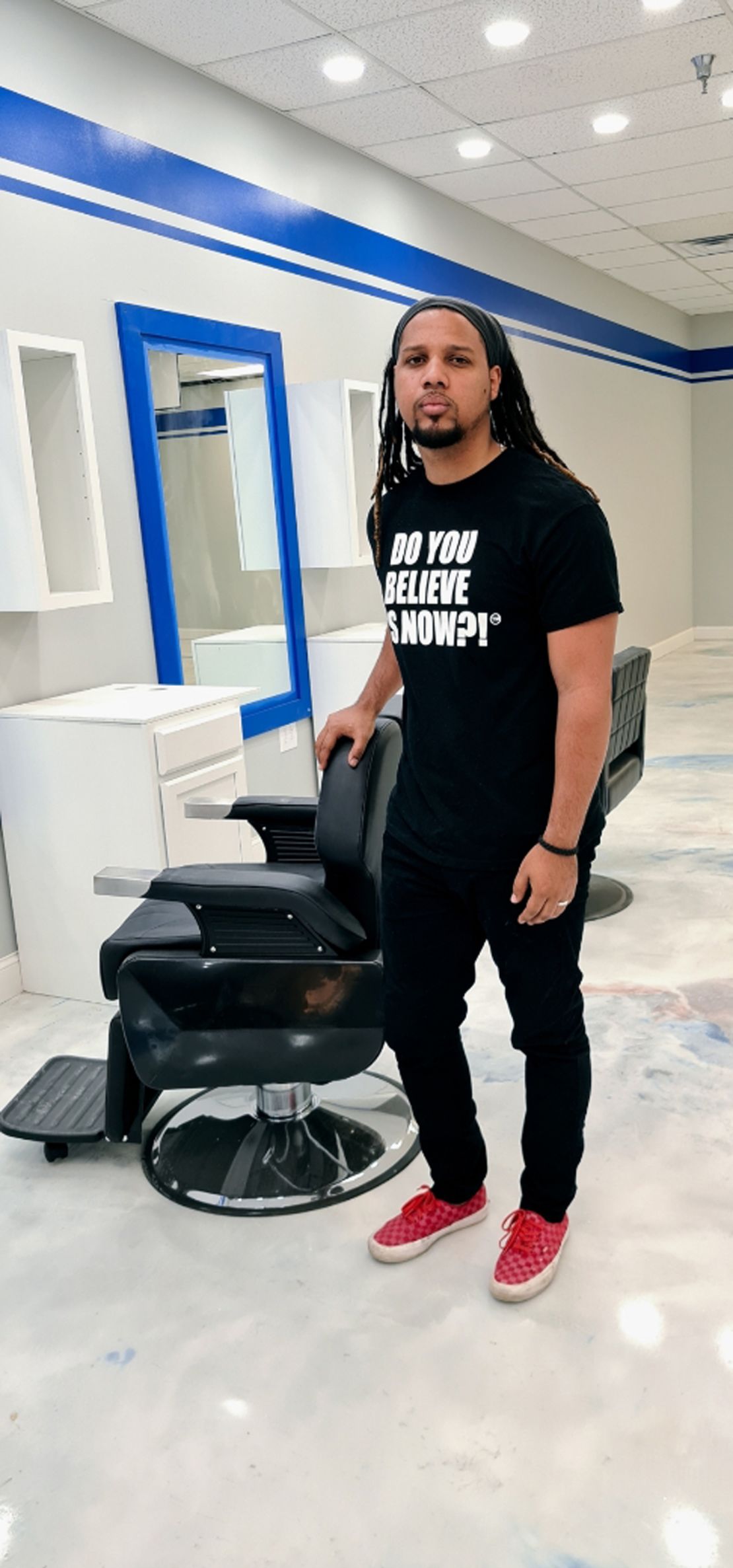 Santana, a key witness in Michael Slager's trial, poses in his soon-to-open barbershop.