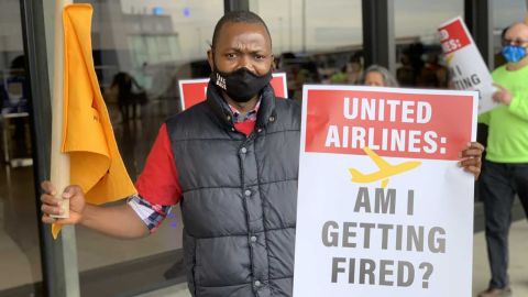 United Airlines transportation coordinator Jenkins Kolongbo protests outside the Newark Liberty International Airport in Newark, New Jersey, on April 7, 2021 after learning the company is considering layoffs.