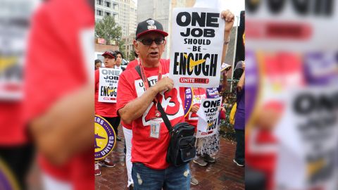 United Airlines catering driver Fernando Herrera protests outside the George W. Bush International Airport in Houston on April 7, 2021 after learning the company is considering layoffs.
