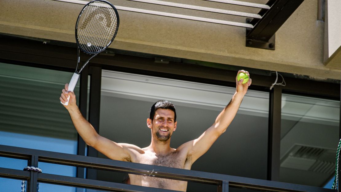 Tennis player Novak Djokovic exercises on his hotel balcony while in quarantine in Australia in January.