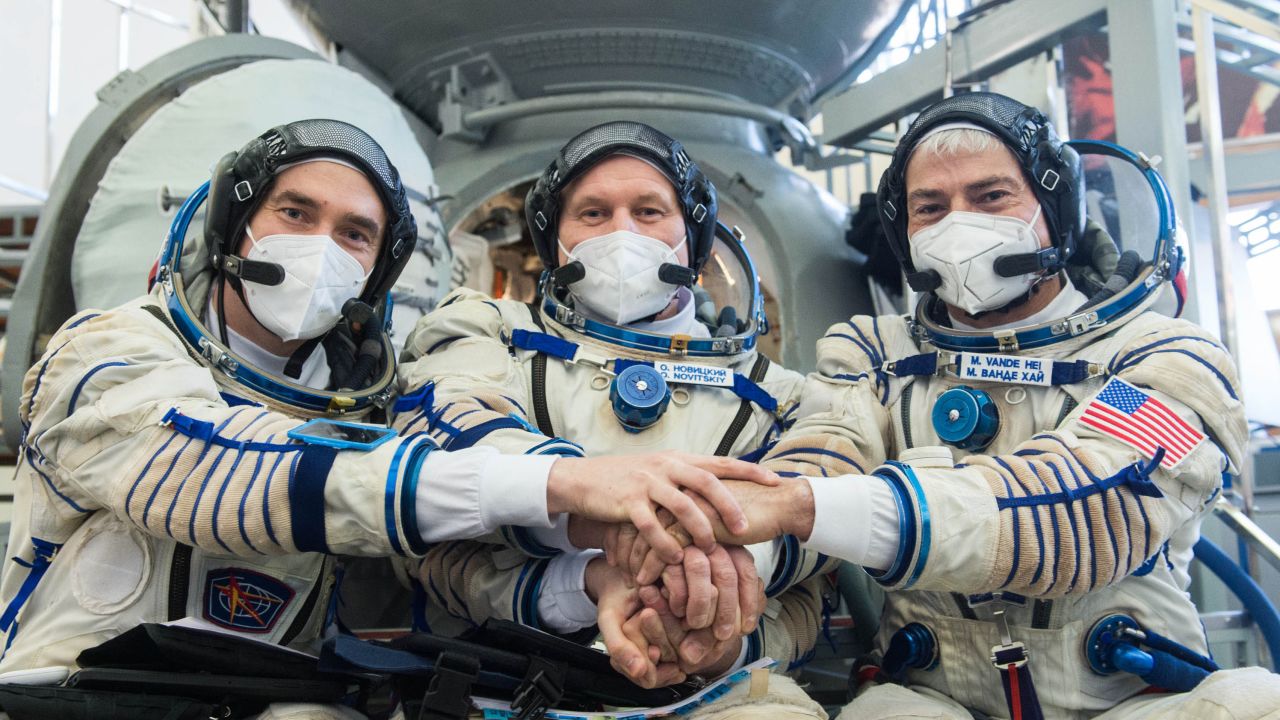 Expedition 65 crew members include (from left) Russian cosmonaut Pyotr Dubrov of Roscosmos, Russian cosmonaut Oleg Novitskiy of Roscosmos, and NASA astronaut Mark Vande Hei.