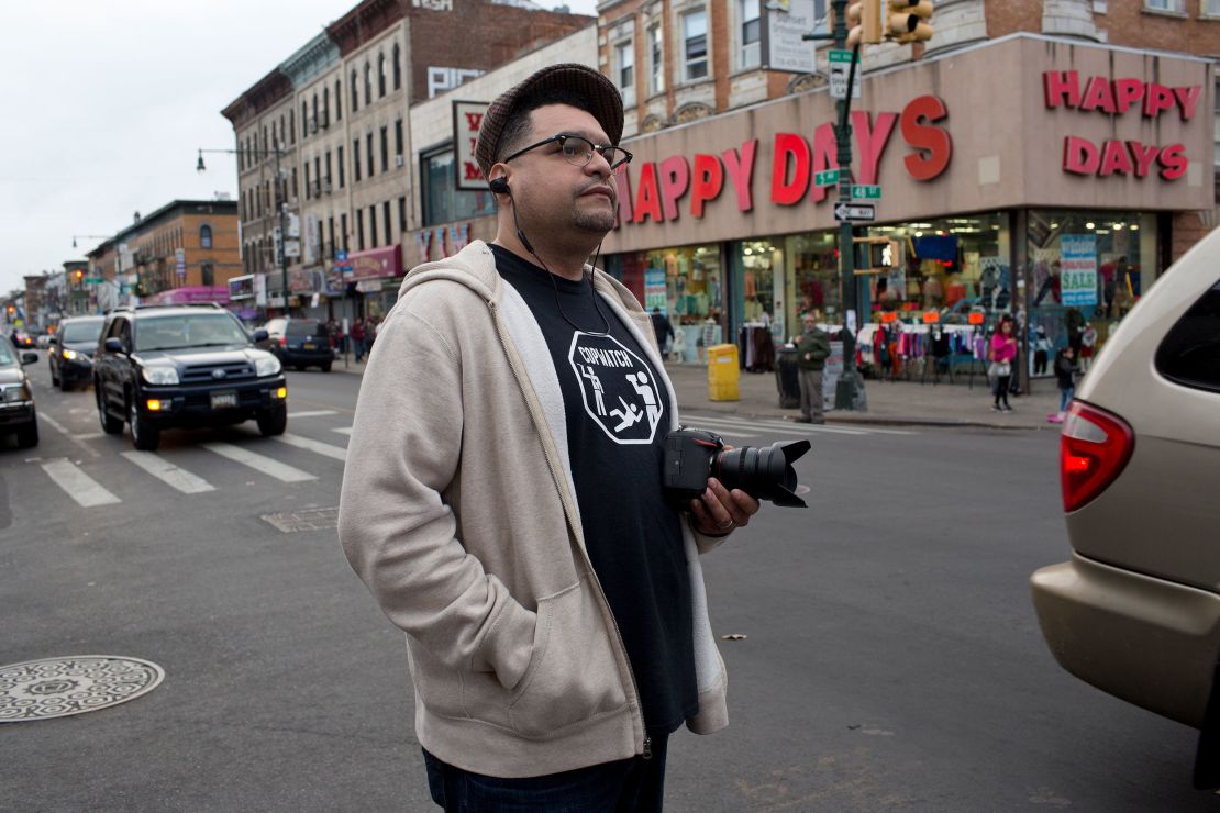 Dennis Flores patrols his neighborhood for police harassment and immigration raids in 2017.