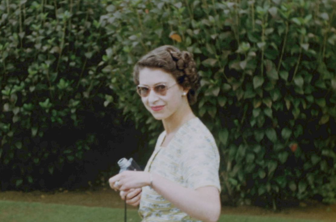 The Queen, pictured wearing sunglasses, enjoyed a stay as a guest at the house of then-governor general of New Zealand, Willoughby Norrie. 