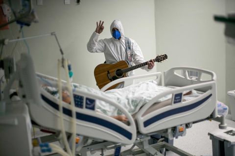 A health worker at a charity hospital in Belém, Brazil, sings and prays for a Covid-19 patient as part of Easter celebrations on April 4.