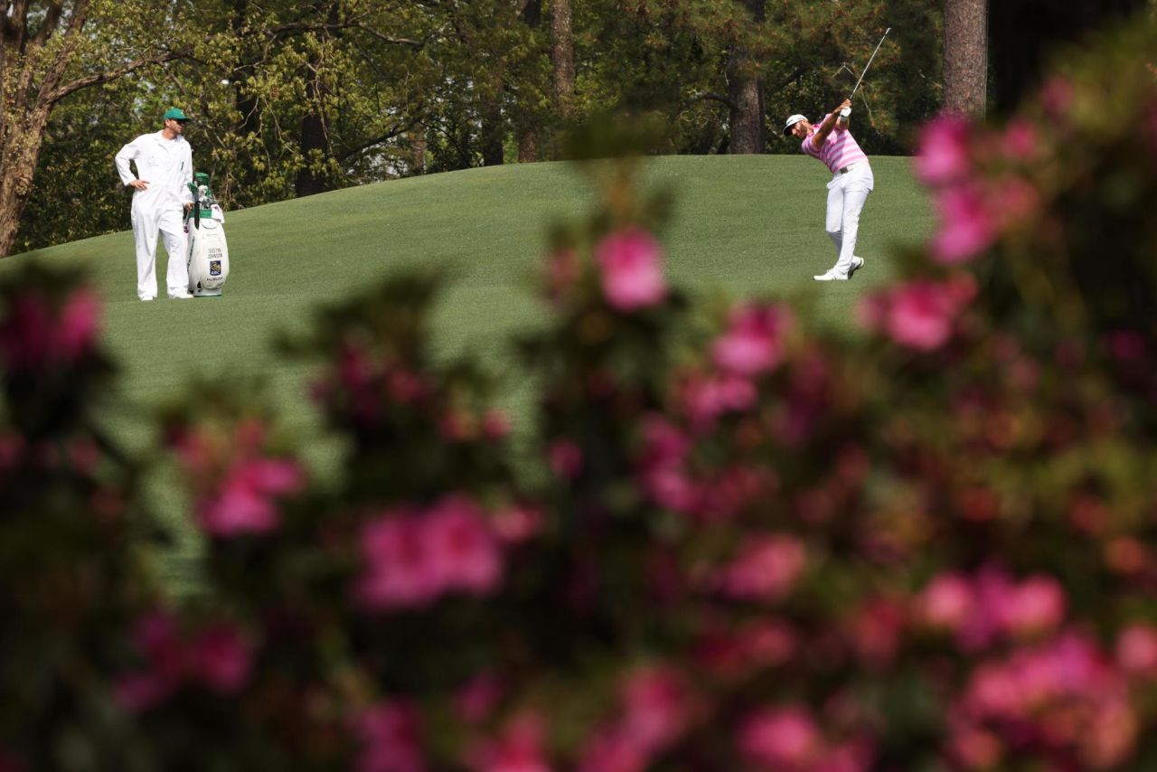 Dustin Johnson, last year's Masters champion, plays a shot on the second hole on Thursday.