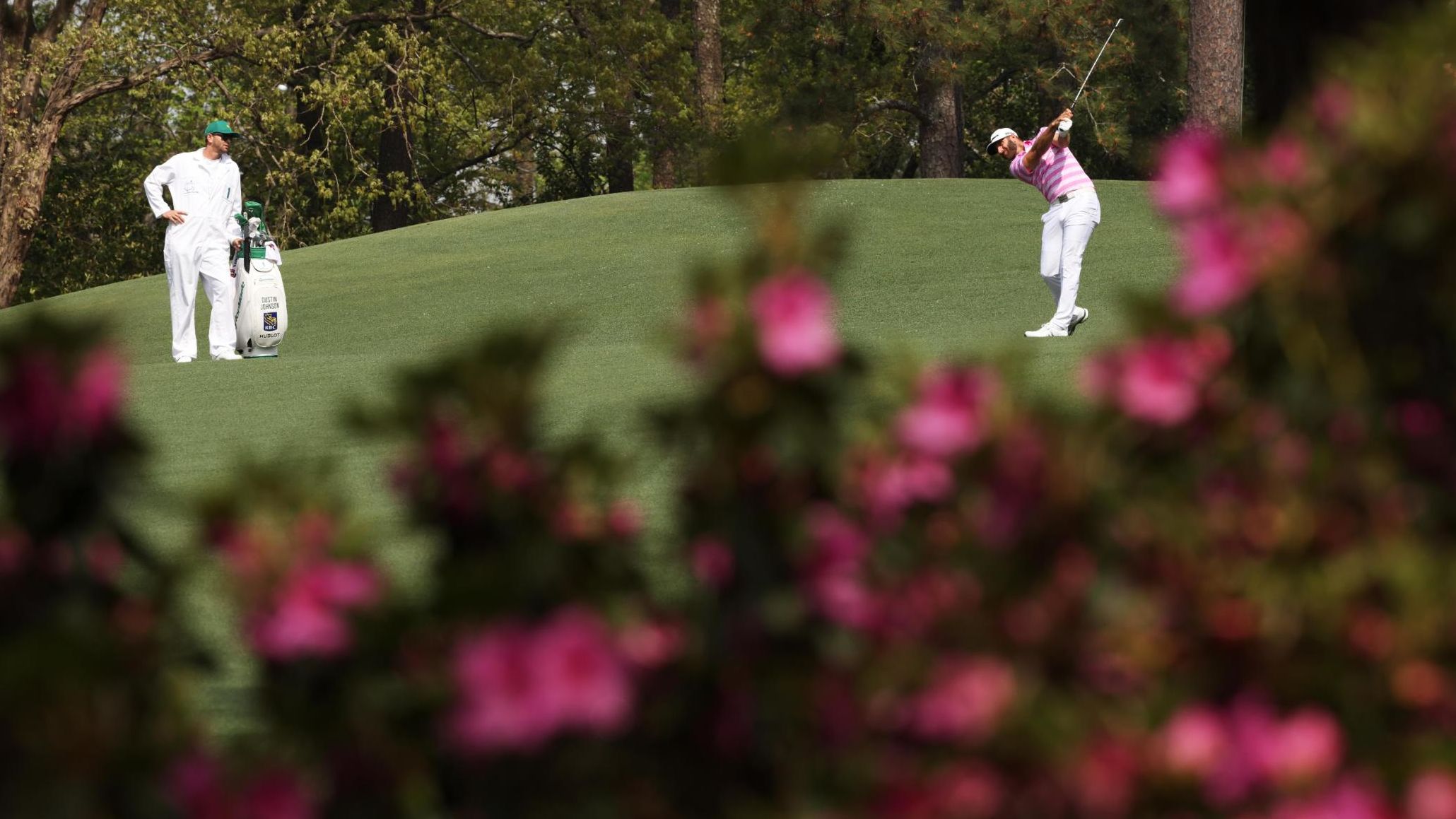 Dustin Johnson, last year's Masters champion, plays a shot on the second hole on Thursday.