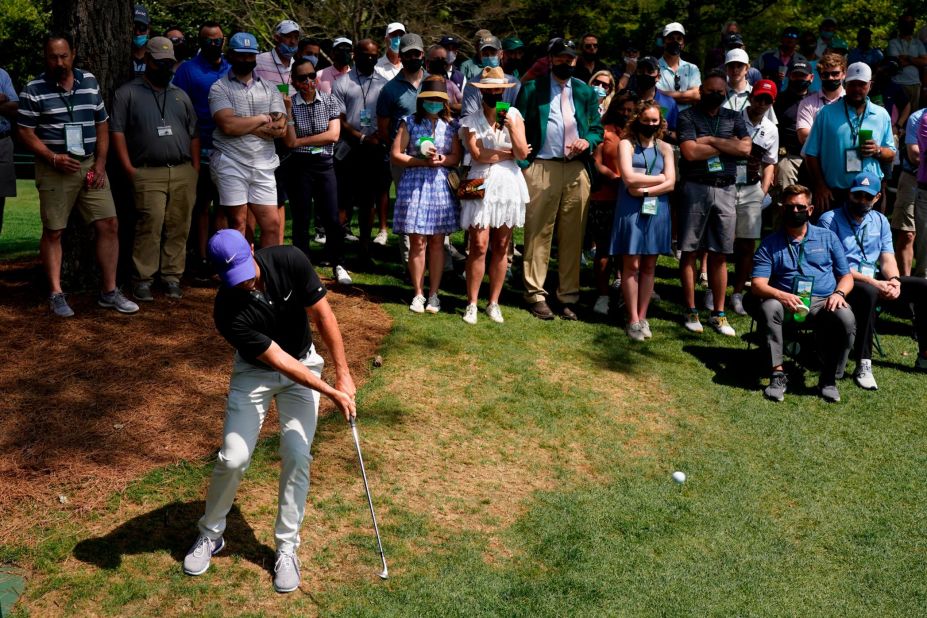 Rory McIlroy hits out of the rough on the sixth hole Thursday.