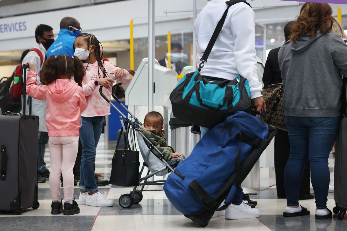 Travelers arrive for flights at O'Hare International Airport in Chicago on March 16, 2021. US airports are seeing pandemic-era record numbers of passengers.