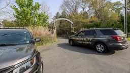 A York County sheriff vehicle drives onto the property where multiple people, including a prominent doctor, were fatally shot a day earlier, Thursday, April 8, 2021, in Rock Hill, S.C. A source briefed on the mass killing said the gunman was former NFL player Phillip Adams, who shot himself to death early Thursday. (AP Photo/Nell Redmond)