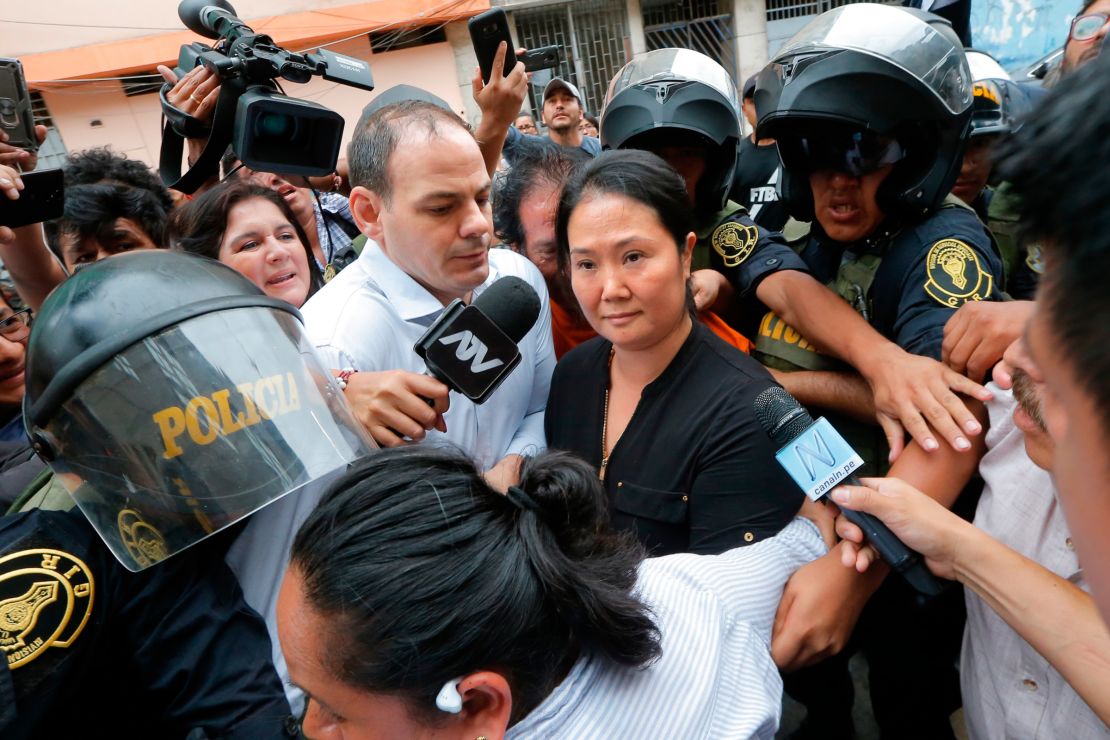 Keiko Fujimori (R) came in joint first in a recent poll but is under investigation for corruption.