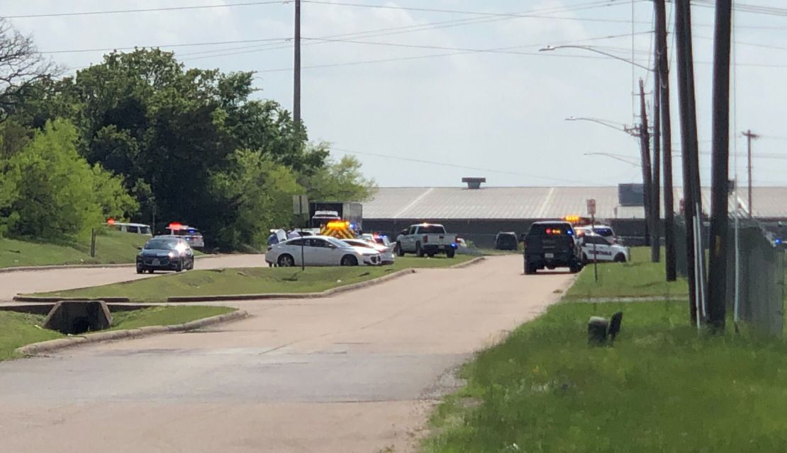Law enforcement responds to a reported shooting at a business in Bryan, Texas, on Thursday, April 8.