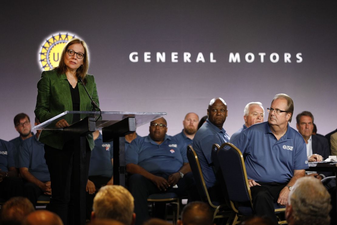 General Motors Chairman and CEO Mary Barra speaks while and United Auto Workers President Gary Jones (right) listens before they opened the 2019 GM-UAW contract talks with the traditional ceremonial handshake on July 16, 2019 in Detroit.