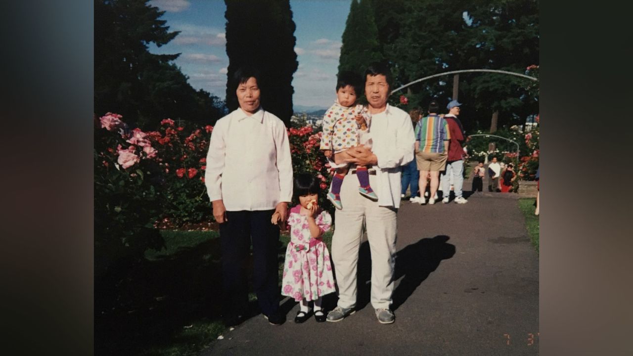 Selina and her sister with their grandparents in the US.