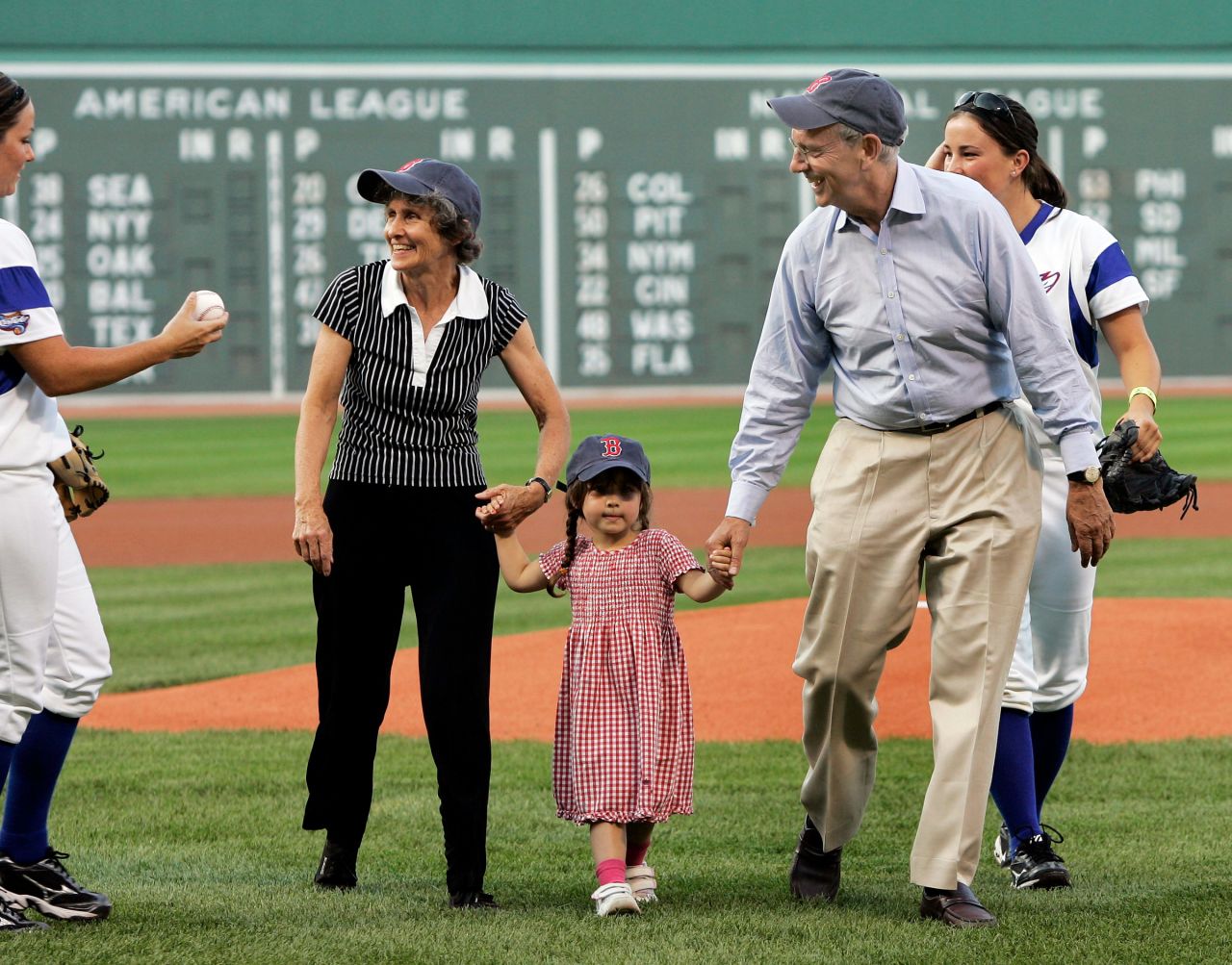 Breyer walks off the field with his wife, Joanna, and their 3-year-old granddaughter, Clara Scholl, after throwing a ceremonial first pitch at Boston's Fenway Park in July 2006.