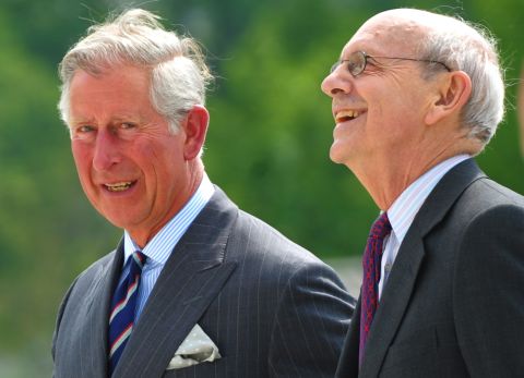 Breyer walks with Britain's Prince Charles as Charles visited the Supreme Court in May 2011.