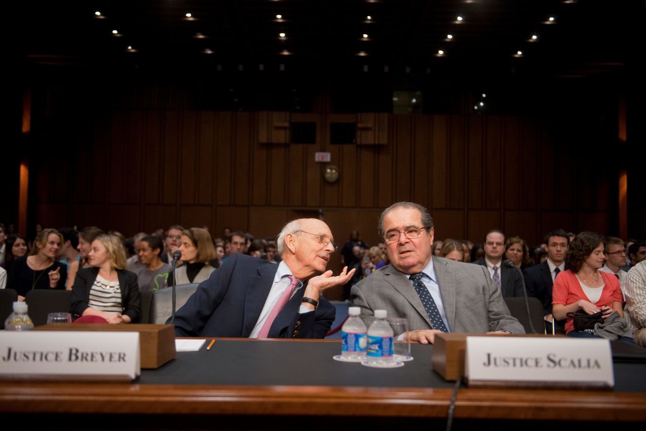 Breyer and fellow Supreme Court Justice Antonin Scalia confer in October 2011 before testifying at a Senate Judiciary Committee hearing entitled "Considering the Role of Judges Under the Constitution of the United States."