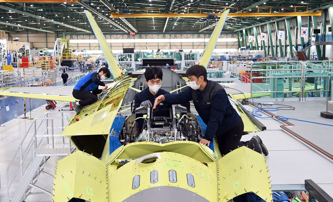 A handout photo released by KAI shows workers of Korea Aerospace Industries (KAI) assemble the first prototype of South Korea's indigenous fighter jet at its plant in the southeastern city of Sacheon, South Korea in January.