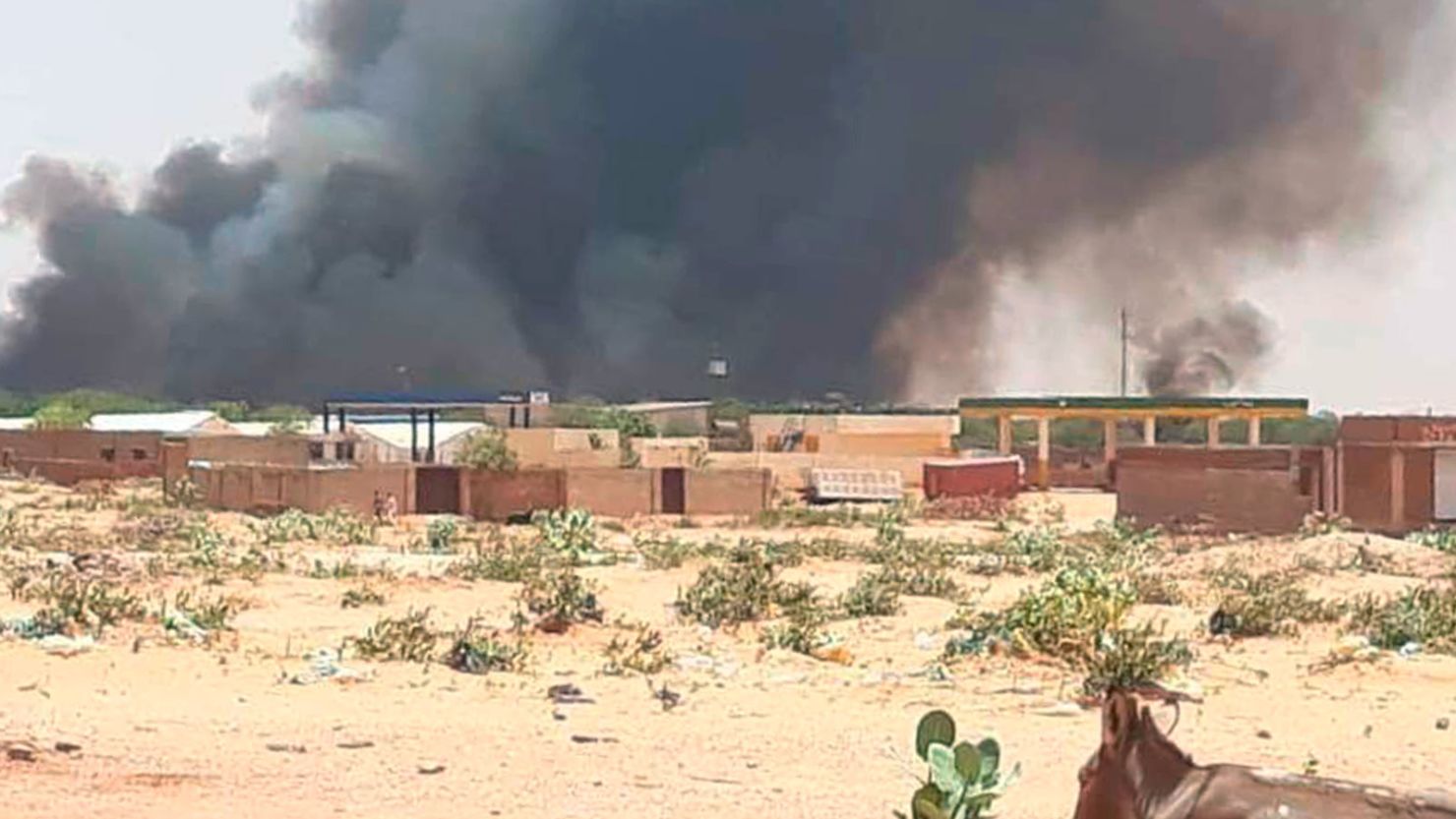 Smoke rises from the Abu Zar camp for displaced persons in West Darfur, Sudan, on Tuesday.