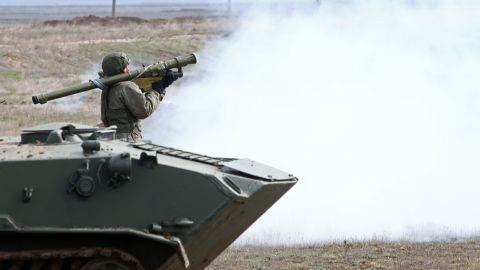 A Russian serviceman fires a Verba air defense system during an exercise at Opuk range in Crimea. 