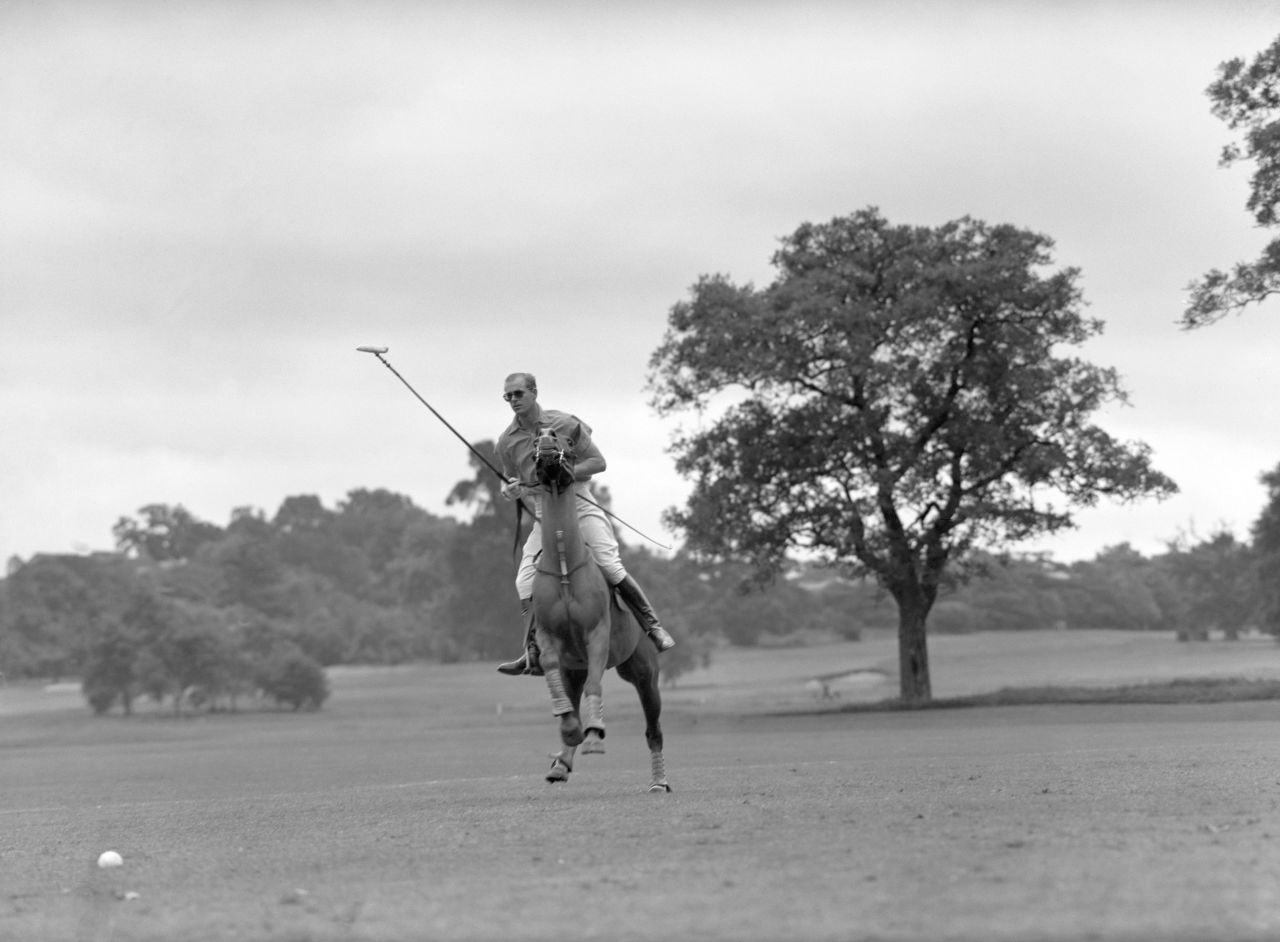 Prince Philip plays polo for Cowdray Park in the semi-finals of the Roehampton Cup in 1954.