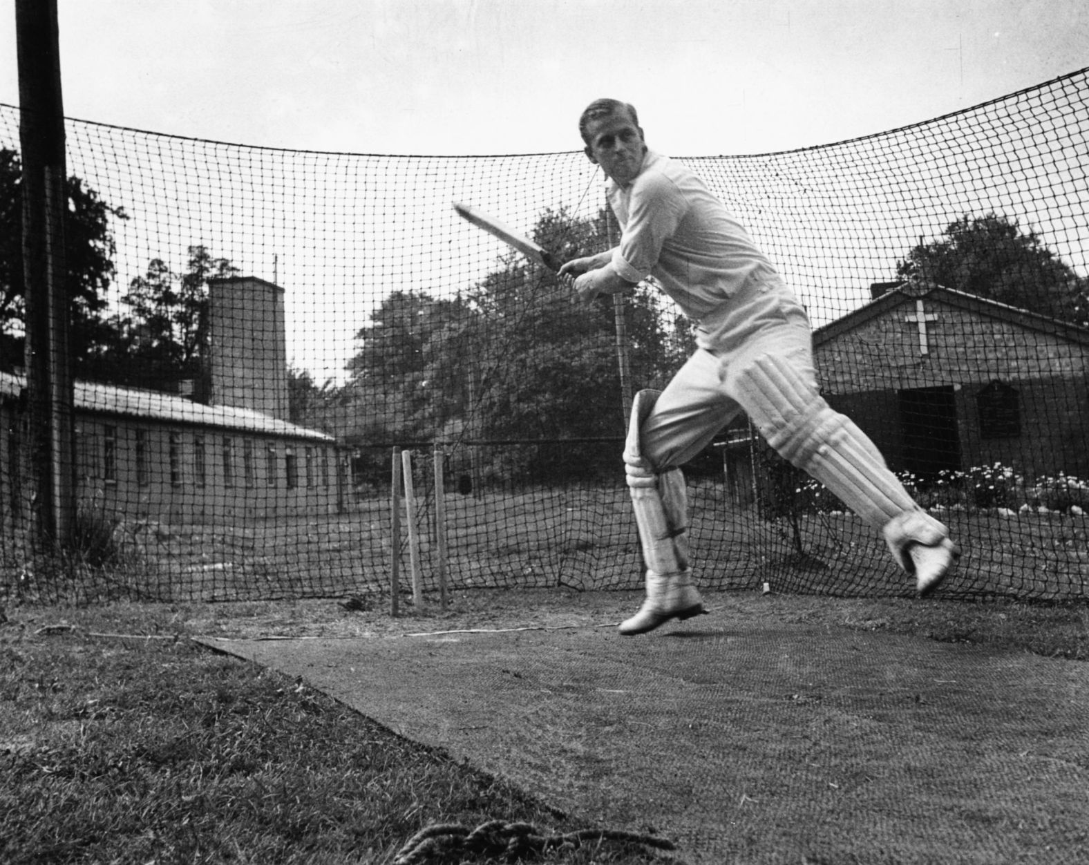 Prince Philip practices cricket while in the Royal Navy in 1947.